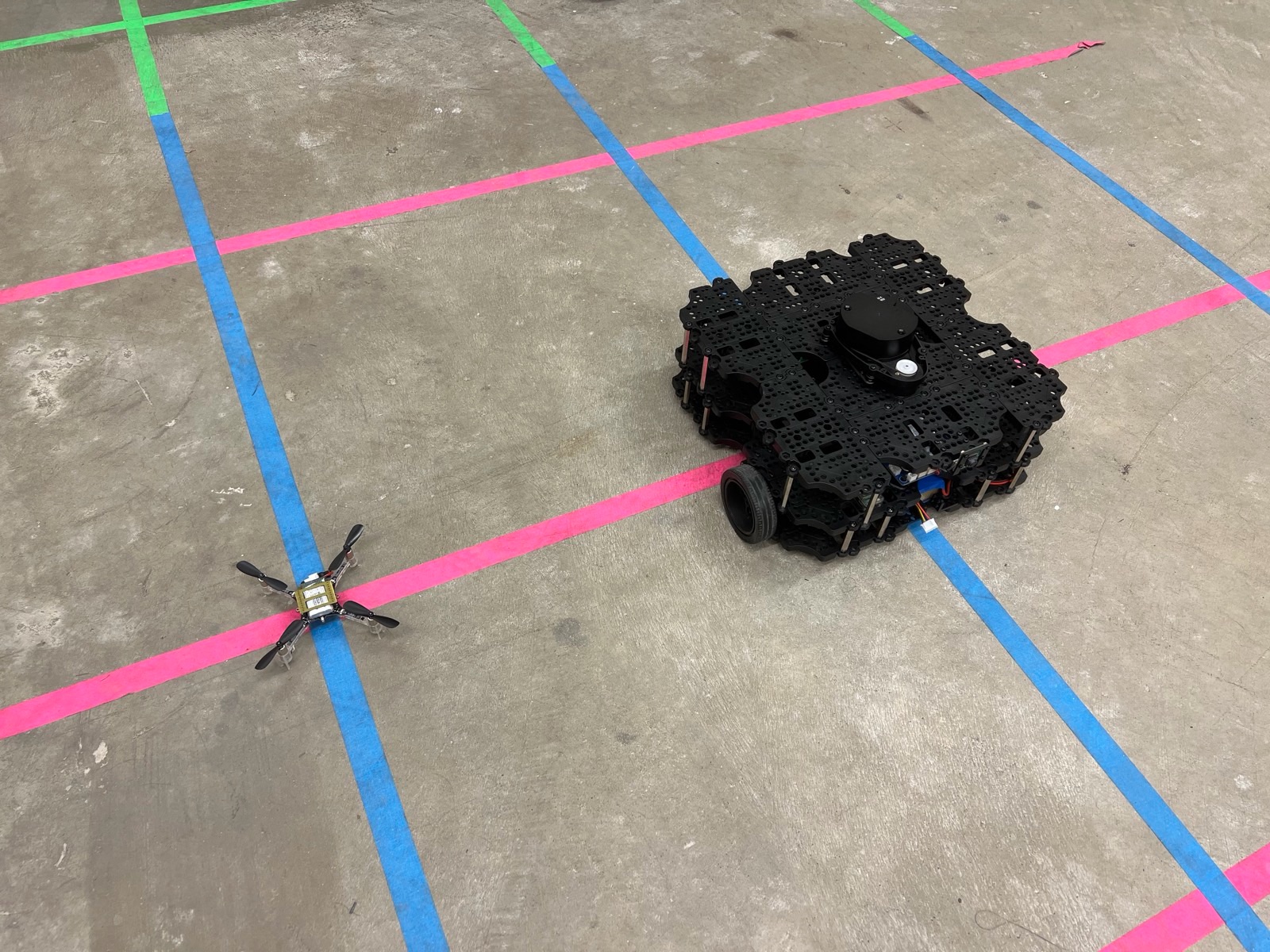 Crazyflie micro-drone and TurtleBot ground robot on the lab floor