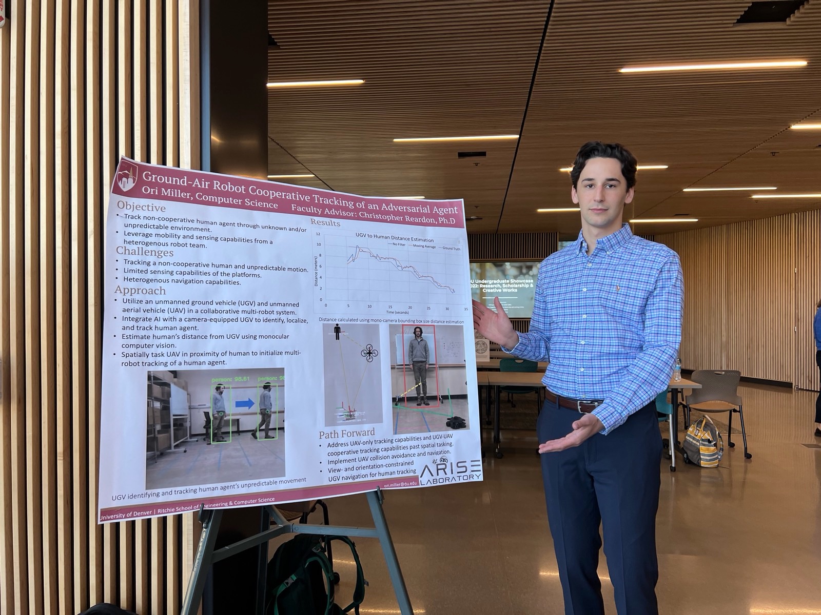 Ori presenting research poster at the University of Denver